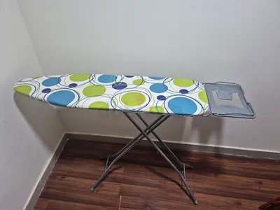 Used ironing board with patterned cover - good condition