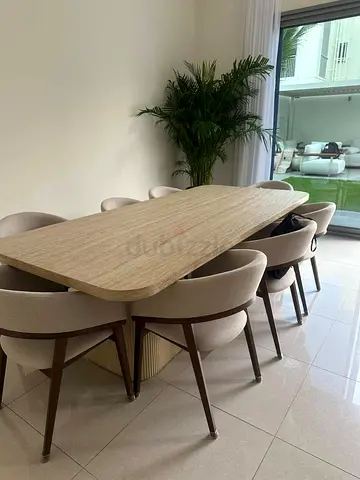 Available high quality dining table with 8 chairs like a new