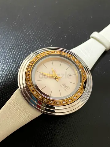 White leather womens wristwatch with crystal bezel