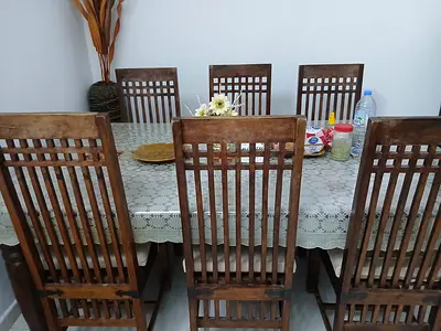 Large wooden dinning table with 6 chairs