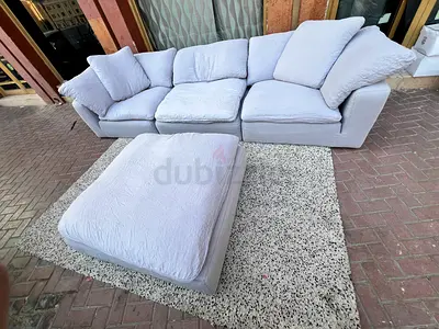 Gray luscious feather filled sofa with footstool