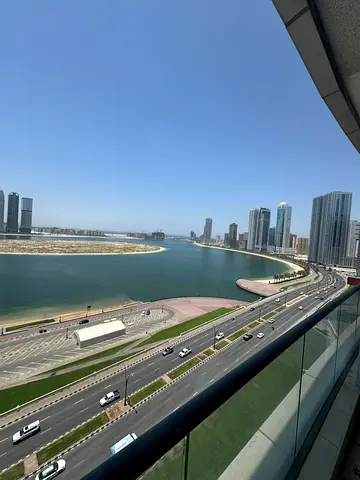 Luxury three-bedroom apartment with a maid's room for annual rent in Sharjah, Al Mamzar area | Free AC | Gym - Swimming pool | Free parking | 3 bathro