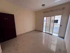 Apartment for annual rent in Al Hamidiya 1 area, Ajman - Central air conditioning - 2 balconies - Fl