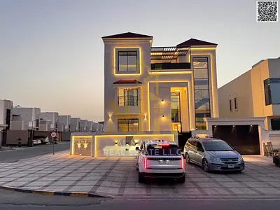 Corner villa, two floors and a roof, with a distinctive and very elegant classic design, in a prime location in Al Zahia, freehold ownership for life
