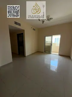 Two-bedroom apartment with a living room, built-in wardrobes, annual rent with private parking.