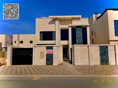 For sale, a luxury villa in a prime location in Al Alia Area Ajman, directly facing a main paved roa