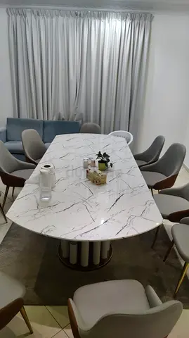 Modern white marble-effect dining table with 10 chairs