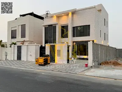 A high-rise building with an area of ​​4350 sq ft, two floors and a roof, 8 master bedrooms, a majlis and a living room, a fully equipped modern kitch