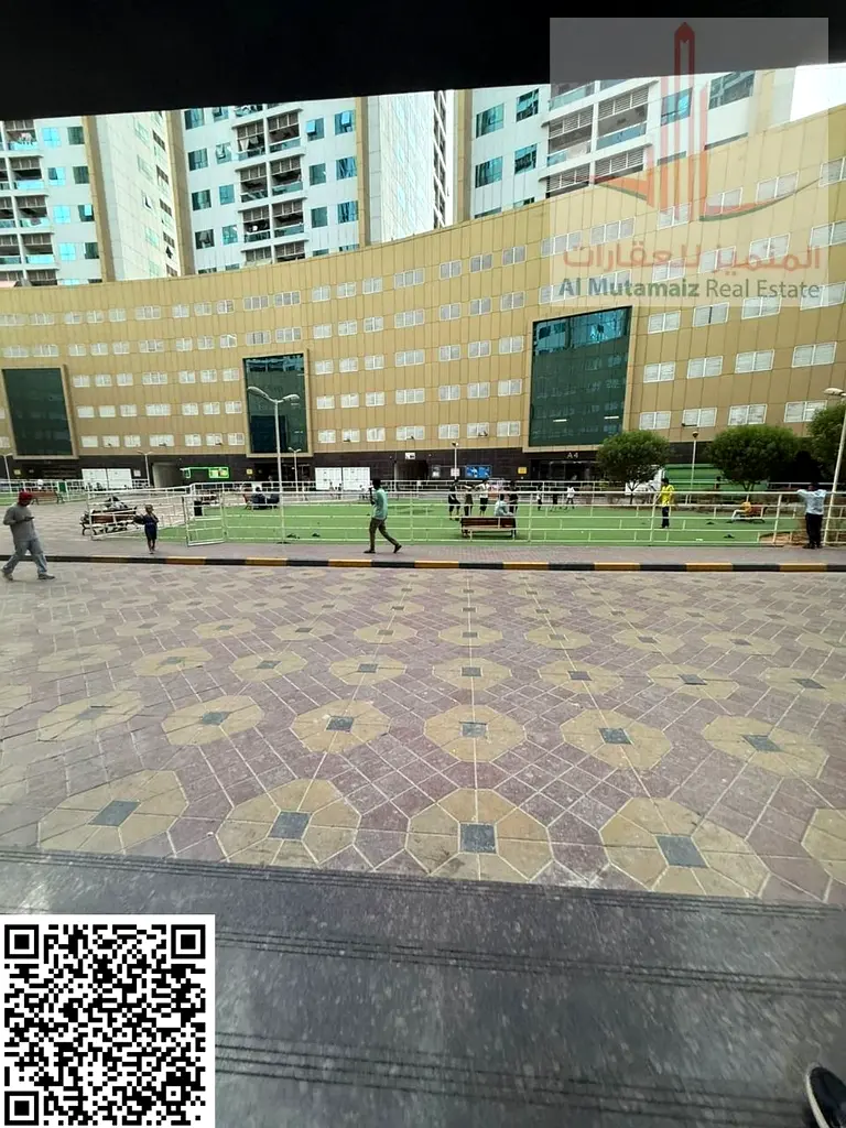For sale in Ajman: a one-bedroom apartment with private parking in Pearl Towers, measuring 940 sq ft. Asking price: AED 330,000 cash.
