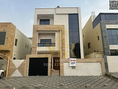 Two-story villa with a roof terrace, priced inclusive of electricity and water fees, located on the main street, ready for occupancy in one of Ajman's