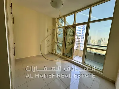 3-bedroom apartment with balcony and large terrace for annual rent in Al Khan with free parking, maintenance, gym, and pool