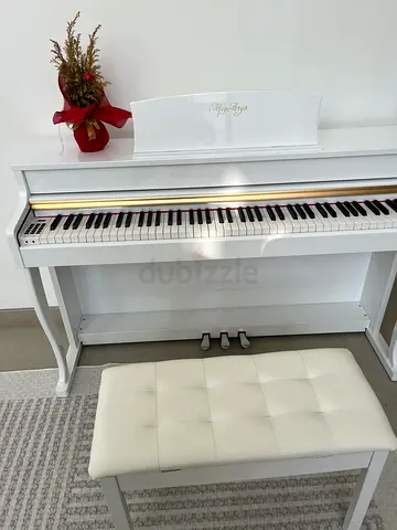 White digital upright piano with bench – gently used
