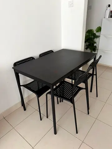 Minimalist Black Dining Table with 4 Matching Chairs