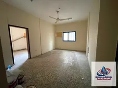 Spacious three-bedroom apartment with a living room in Al Shuweiheen, featuring two balconies and tw