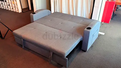 Grey Convertible Sofa Bed with Cup Holders — Good Condition