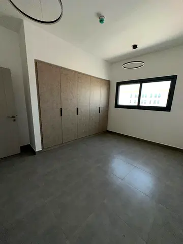 Tilal Sharjah, a prime location close to all services. It includes 1 bathroom, a balcony, central A
