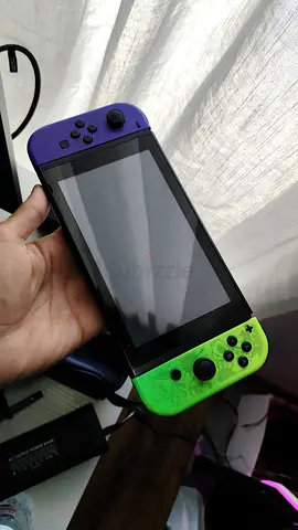 Nintendo Switch (handheld) with colorful Joy‑Cons - power button problem
