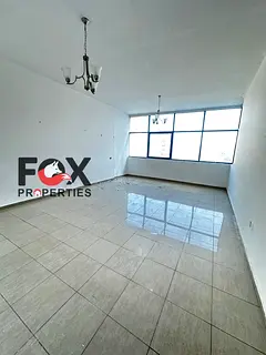 Two rooms and a hall for annual rent first row in Ajman Corniche balcony with sea view free parking