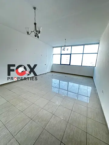 Two rooms and a hall for annual rent first row in Ajman Corniche balcony with sea view free parking central air conditioning master room 3 bathrooms