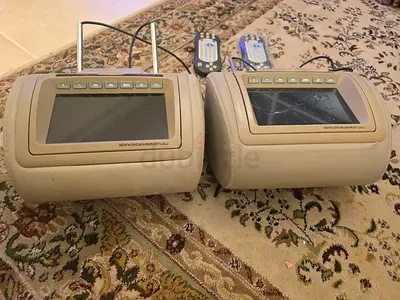 Car head rests with screen (beige colour(