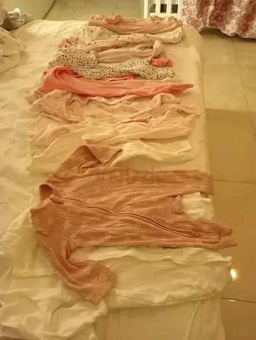 Lot of baby girl onesies and sleepers - various pink/neutral sizes
