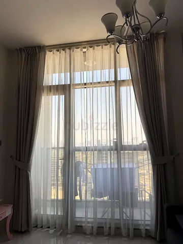 Full-length light gray curtains with sheer liners - good condition