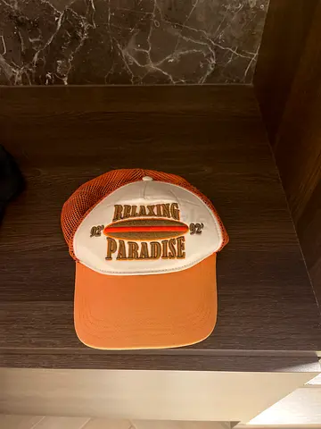 Orange mesh trucker cap with Making Paradise embroidery - used