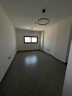 1BR hall, first tenant, Tilal City Sharjah, direct Dubai exit, brand new building, 2 bathrooms, buil