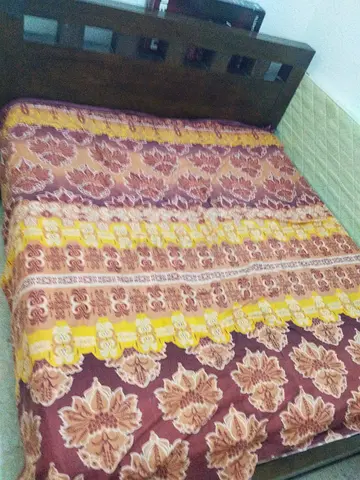 Wooden king sizebed frame with mattress and floral bedding - good condition