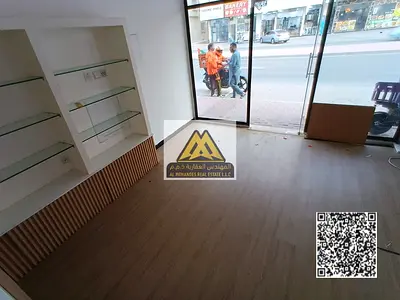 A prime shop in a vibrant location on Al Muwaihat Main Street, ideal for starting your business in a lively area close to all services.