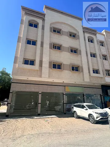 For sale, a building in the Muwaileh commercial area. Number of floors, ground and 3 floors. Area: 3,000 square feet. The building consists of 9 apart
