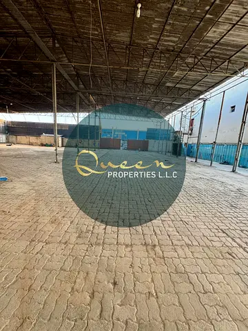 Warehouse entrance on a main street for easy truck access in Industrial Area 6 - Sharjah