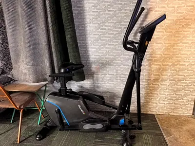 Stationary bike cardio with digital tracker adjustable seat adjustable tension and wheels.