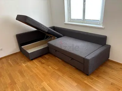 L-shaped grey fabric sofa bed with storage (corner, good condition)