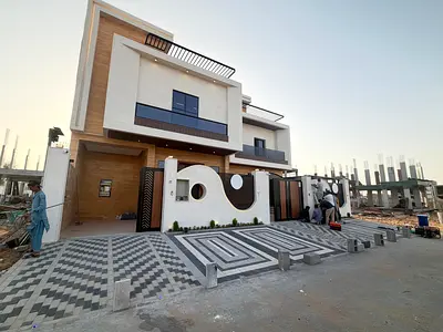 Villa for sale, freehold, for all nationalities, near Sheikh Mohammed Bin Zayed Road, including registration and ownership fees.
