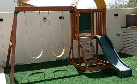 Wooden Swing Set with Slide and Climbing Ladder - Good Condition. Bought from Danube.