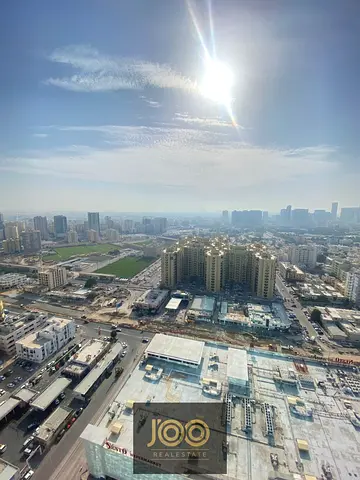 Vacant 1BHK apartment in Oasis Towers, closed kitchen, 2 baths, parking, pool & gym – ready to move in for AED 440,000!