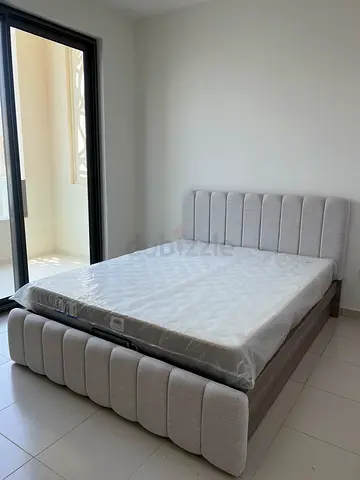 Light grey upholstered bed frame with mattress - excellent condition