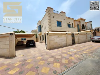 Corner villa for sale in Al Muwaihat 2, Ajman, with a large setback.