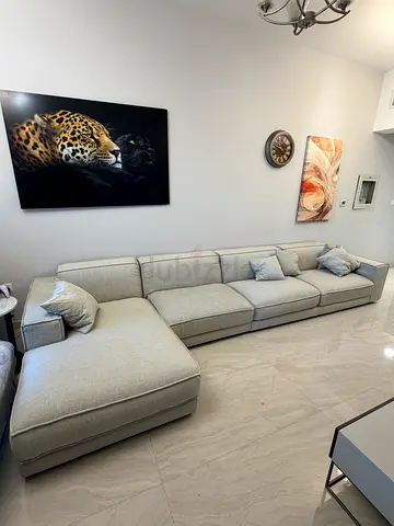 Light grey L-shaped sectional sofa with ottoman - good condition