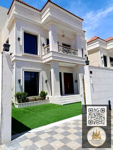 Distinctive villa consisting of 2 floors and a roof in the Al Helio area of ​​Ajman, including registration fees, central air conditioning, and a sp