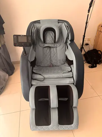 Massage chair in new condition used couple of times (new price 2000 dirhams)