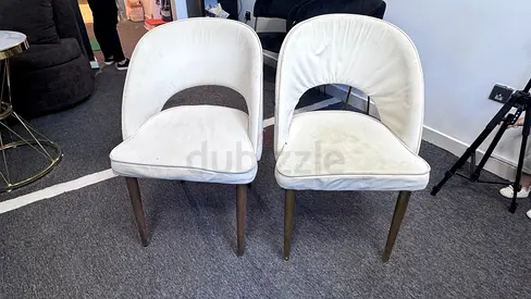 Pair of white upholstered dining/side chairs with wooden legs