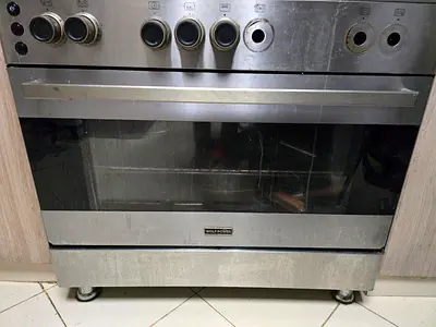 Used stainless steel built-in gas oven / cooker - needs knobs