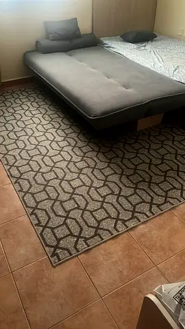 Single bed with side table and mattress