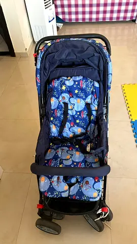 Lightweight navy blue baby stroller with playful print — good condition