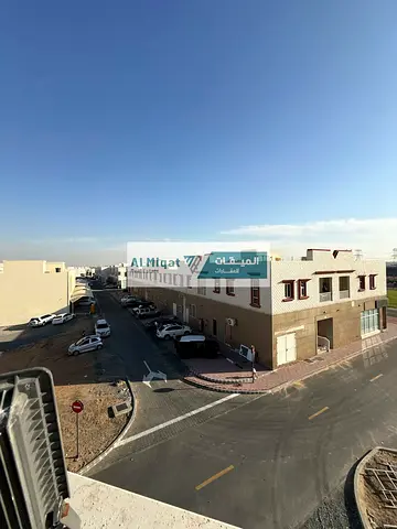 بناية ارضى + اول للبيع فى الحوشى الشارقة