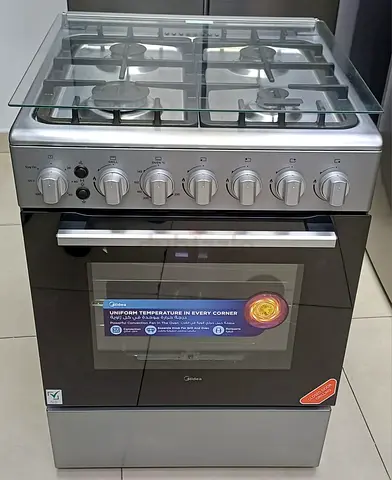 Stainless Steel 4-Burner Gas Cooker with Oven — Good Condition