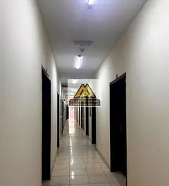 Workers' camp for monthly rent, consisting of 9 rooms | Large area, excellent price | Al-Jarf In
