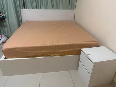 White wooden double bed with matching 2-drawer bedside table - good condition